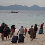 Таиланд бепул даволанишдан келиб чиқадиган харажатларни камайтириш учун суғурта талаб қилмоқчи